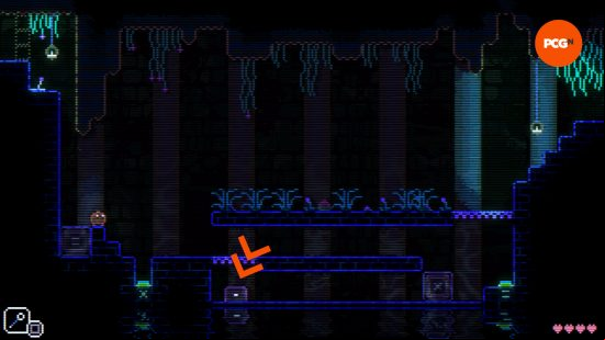 an orange arrow in animal well showing the location of an egg